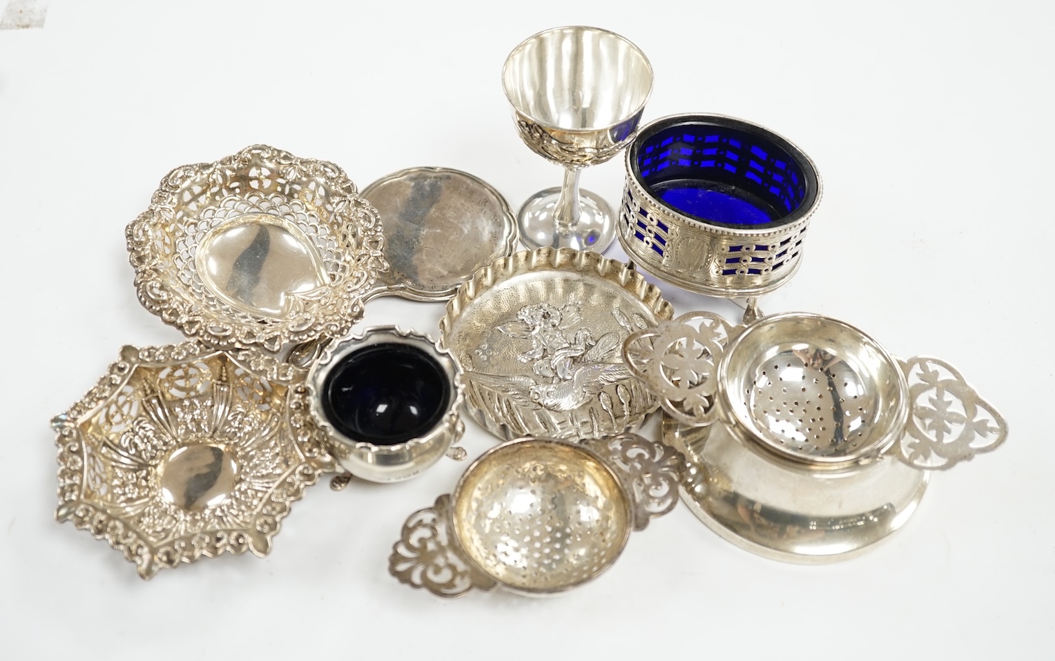 Sundry small silver including a, tea strainer, handbag mirror, pin dish, pair of bonbon dishes, two condiments and a Chinese white metal egg cup?. Condition - fair